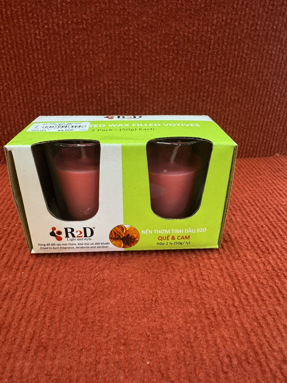 23. Nến tinh dầu quế màu cam